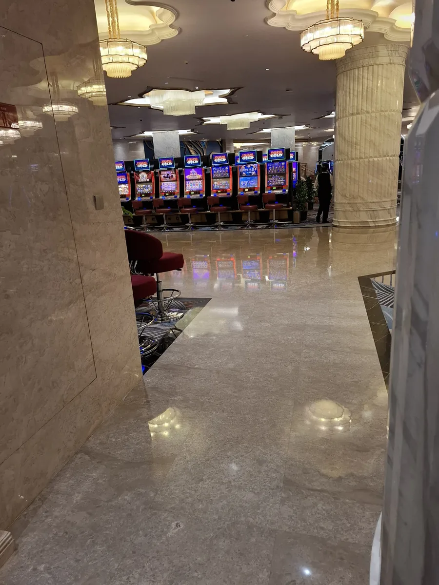 Row of slot machines on a casino floor, the physical version of the real money online slots Canadian players spin
